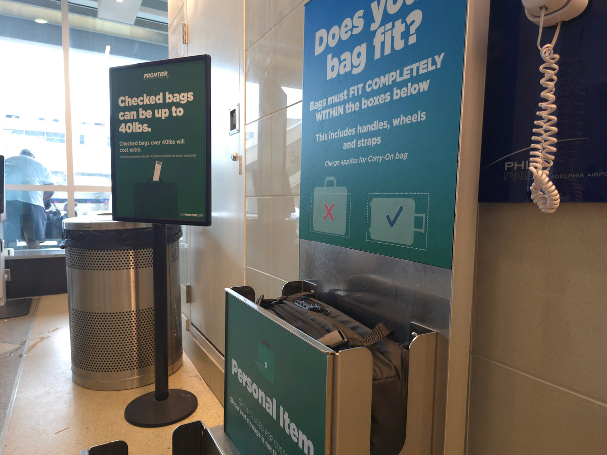 Nomadity Discoverer 60L backpack inside an airport personal-item sizing bin